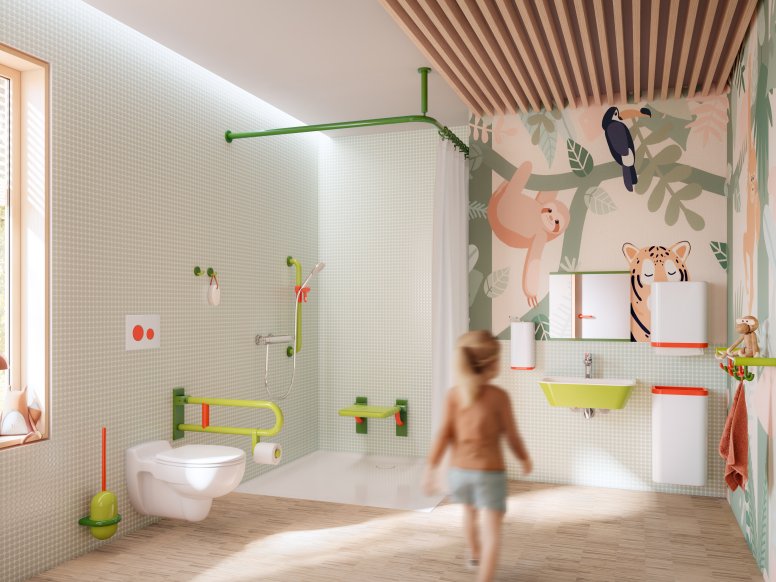 Salle de bain colorée et adaptée aux enfants, équipée d'accessoires sanitaires dans les tons vert, blanc et corail.