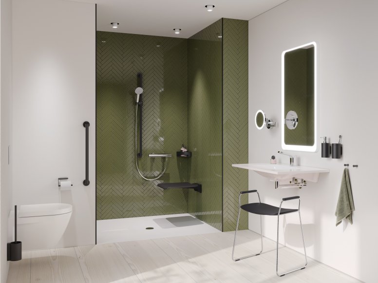 Salle de bain accessible avec lavabo, espace douche et WC